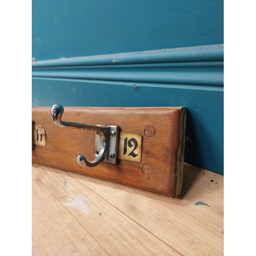 406 - Early 20th C. wooden wall mounted hat and coat rack with numbering 1 to 12. {14 cm H x 215 cm W x 11... 