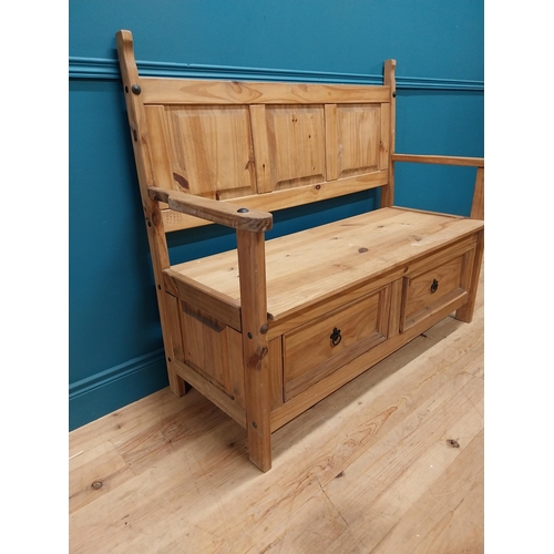 409 - Stripped pine hall bench with two deep drawers in frieze. {108 cm H x 128 cm W x 55 cm D}.