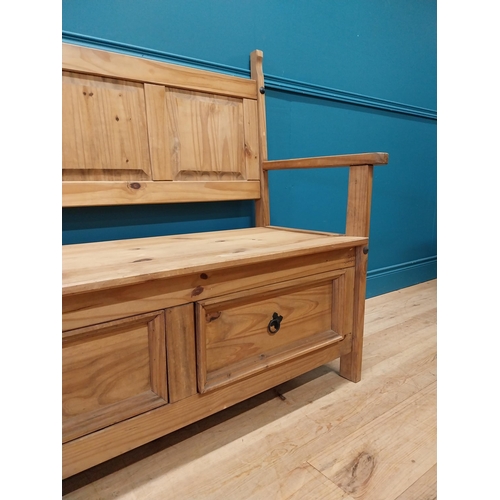 409 - Stripped pine hall bench with two deep drawers in frieze. {108 cm H x 128 cm W x 55 cm D}.