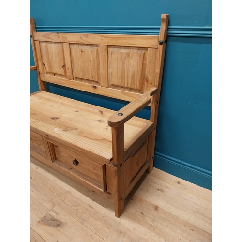 409 - Stripped pine hall bench with two deep drawers in frieze. {108 cm H x 128 cm W x 55 cm D}.