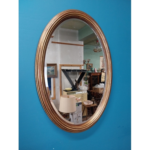 414 - Good quality oval giltwood wall mirror. {80 cm H x 57 cm W}.