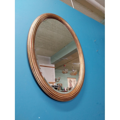 414 - Good quality oval giltwood wall mirror. {80 cm H x 57 cm W}.