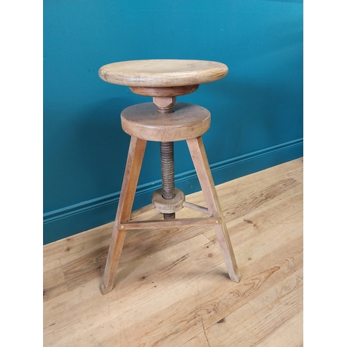 419 - Early 20th C. pine revolving artist's stool of large proportions. {72 cm H x 51 cm Dia.}.