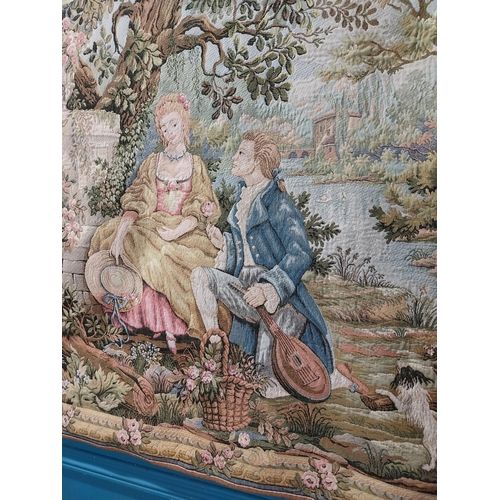 423 - Decorative tapestry depicting courting couple in garden with fountain. {96 cm H x 137 cm W}.