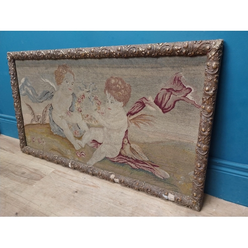 425 - 18th C. French tapestry depicting cherubs holding floral wreath mounted in carved giltwood frame. {5... 