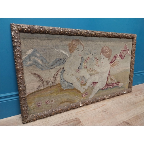 425 - 18th C. French tapestry depicting cherubs holding floral wreath mounted in carved giltwood frame. {5... 