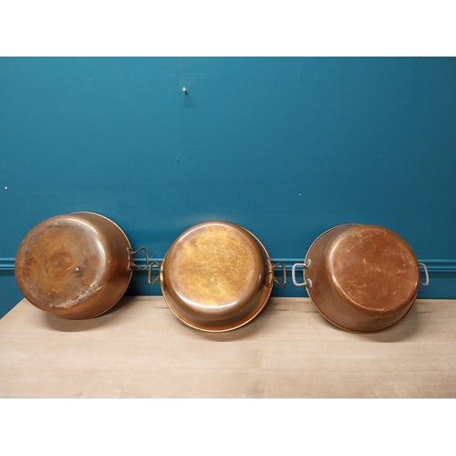 43 - Three copper and brass preserving pans {13cm H x 45cm Dia}