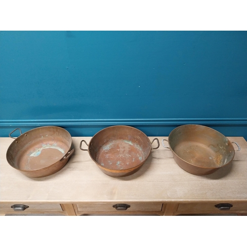 43 - Three copper and brass preserving pans {13cm H x 45cm Dia}