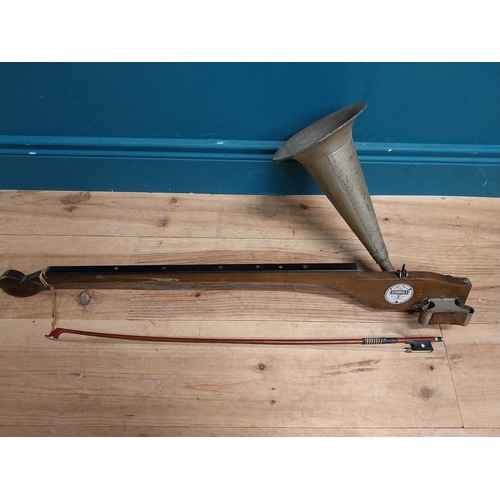 433 - Early 20th C. Stroviols fiddle with tin horn and bow. {84 cm H x 40 cm W x 18 cm D}.