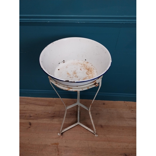 455 - Early 20th C. enamel wash basin on wrought iron stand. {89 cm H x 40 cm Dia.}.