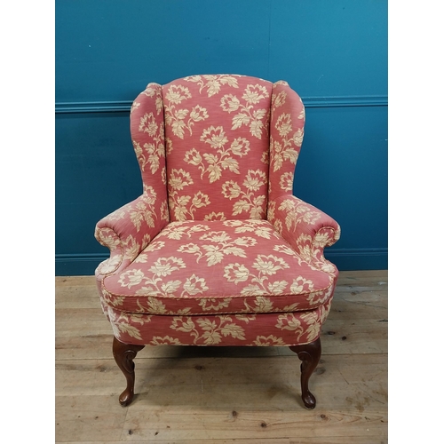 471 - Good quality mahogany and upholstered wing back armchair raised on cabriole legs in the Georgian sty... 