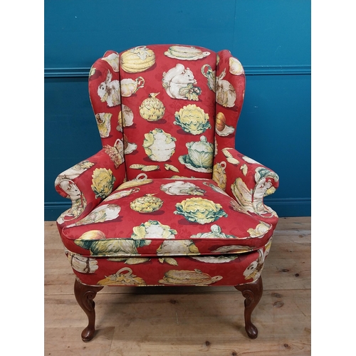 472 - Good quality mahogany and upholstered wing back armchair raised on cabriole legs in the Georgian sty... 