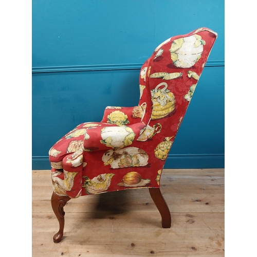 472 - Good quality mahogany and upholstered wing back armchair raised on cabriole legs in the Georgian sty... 