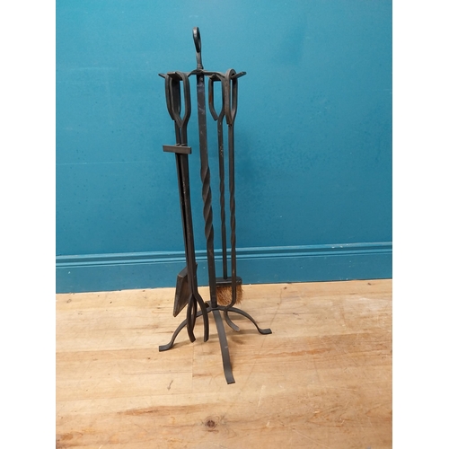 483 - Wrought iron fireside companion set. {82 cm H x 35 cm W x 35 cm D}.