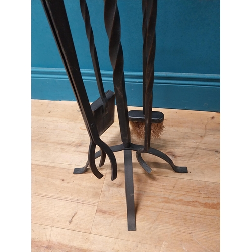 483 - Wrought iron fireside companion set. {82 cm H x 35 cm W x 35 cm D}.