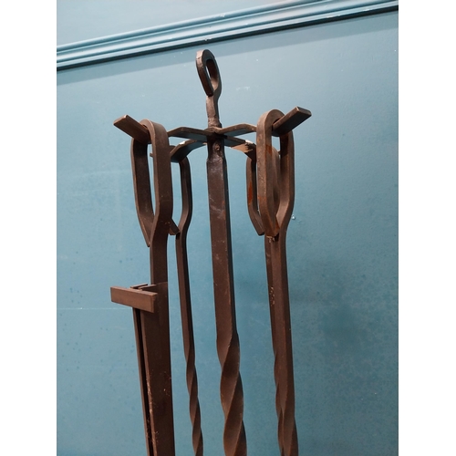 483 - Wrought iron fireside companion set. {82 cm H x 35 cm W x 35 cm D}.