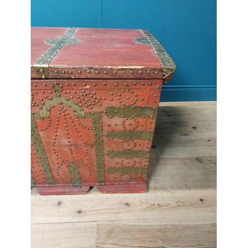 491 - Early 20th C. painted pine trunk with brass stud decoration {67 cm H x 123 cm W x 67 cm D}.