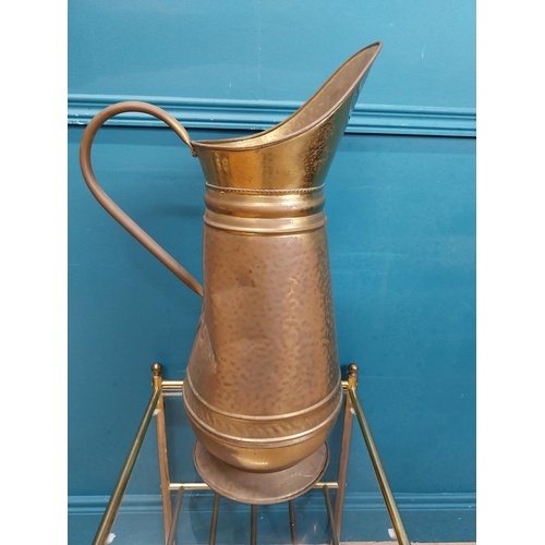 500 - Edwardian brass water jug. {60 cm H x 38 cm W  x 22 cm D}.