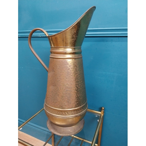 500 - Edwardian brass water jug. {60 cm H x 38 cm W  x 22 cm D}.