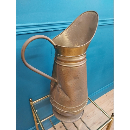 500 - Edwardian brass water jug. {60 cm H x 38 cm W  x 22 cm D}.