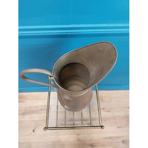 500 - Edwardian brass water jug. {60 cm H x 38 cm W  x 22 cm D}.