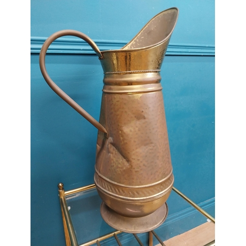 500 - Edwardian brass water jug. {60 cm H x 38 cm W  x 22 cm D}.