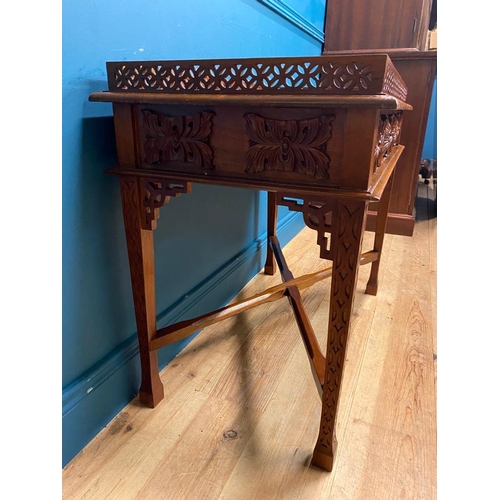 516 - Carved mahogany Chinese silver table in the Chippendale style. {72 cm H x 89 cm W x 50 cm D}.