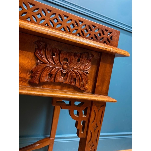 516 - Carved mahogany Chinese silver table in the Chippendale style. {72 cm H x 89 cm W x 50 cm D}.