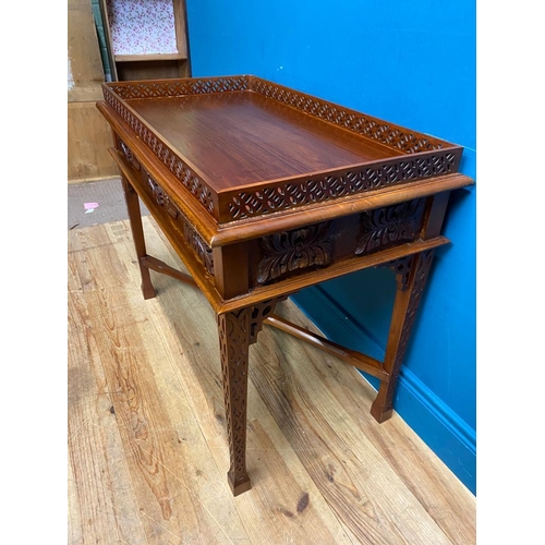 516 - Carved mahogany Chinese silver table in the Chippendale style. {72 cm H x 89 cm W x 50 cm D}.