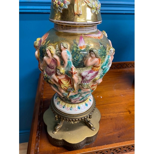 540 - Pair of decorative ceramic and gilded brass table lamps decorated with raised Classical scenes. {86 ... 