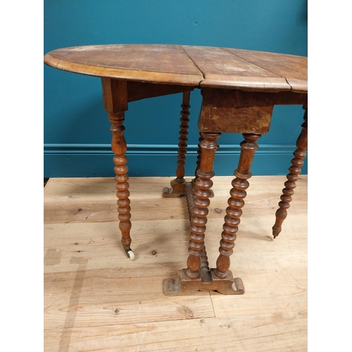 544 - Victorian oak oval drop leaf table in the Pembroke style. {53 cm H x 45 cm W x 70 cm D}.