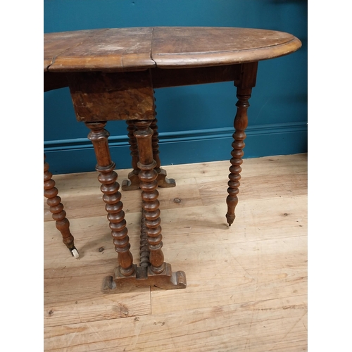 544 - Victorian oak oval drop leaf table in the Pembroke style. {53 cm H x 45 cm W x 70 cm D}.