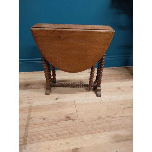 544 - Victorian oak oval drop leaf table in the Pembroke style. {53 cm H x 45 cm W x 70 cm D}.