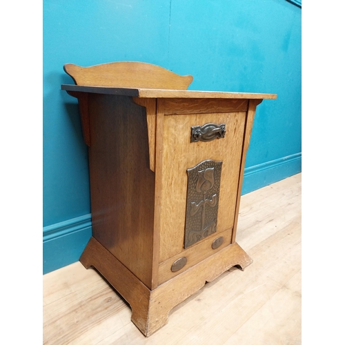 551 - Art Nouveau oak coal cabinet inset with copper panel. {62 cm H x 48 cm W x 33 cm D}.