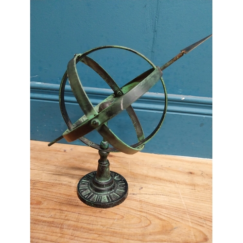 707 - Cast iron armillary sundial. {30 cm H x 30 cm W x 16 cm D}.