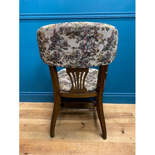 555 - 1940's oak office chair with upholstered seat and back. {92 cm H x 57 cm W x 50 cm D}.