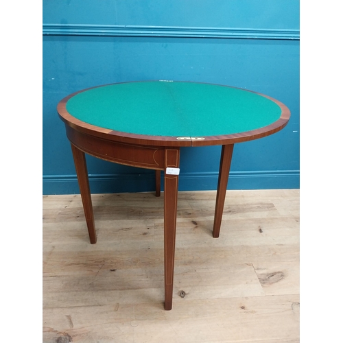 564 - Edwardian mahogany and satinwood inlaid card table on tapered legs. {77 cm H x 89 cm W x 44 cm D}.