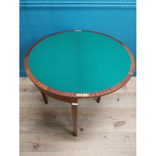 564 - Edwardian mahogany and satinwood inlaid card table on tapered legs. {77 cm H x 89 cm W x 44 cm D}.