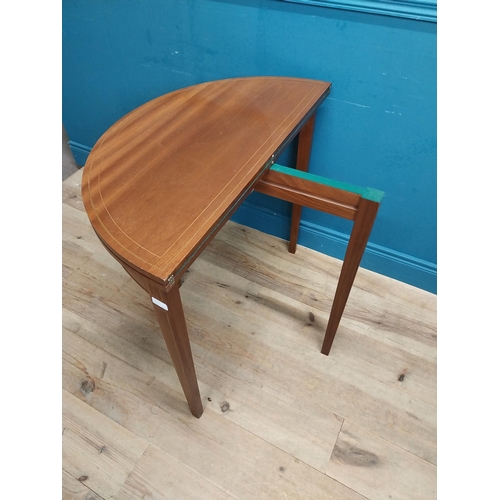 564 - Edwardian mahogany and satinwood inlaid card table on tapered legs. {77 cm H x 89 cm W x 44 cm D}.