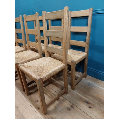 584 - Set of six oak kitchen chairs with rush seats. {104 cm H x 45 cm W x 45 cm D}.