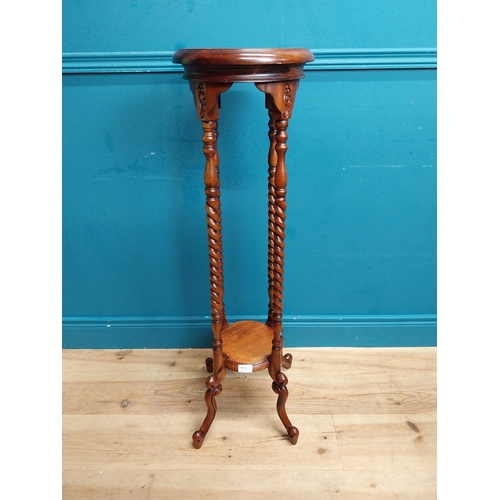 587 - Mahogany jardiniere stand in the Victorian style. {102 cm H x 45 cm Dia.}.