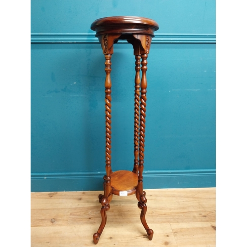 587 - Mahogany jardiniere stand in the Victorian style. {102 cm H x 45 cm Dia.}.