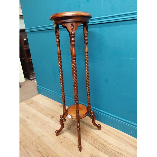 587 - Mahogany jardiniere stand in the Victorian style. {102 cm H x 45 cm Dia.}.