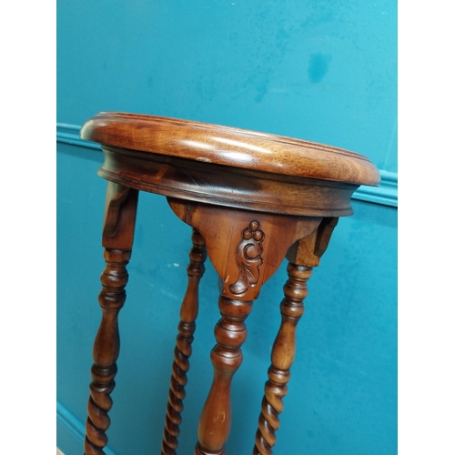 587 - Mahogany jardiniere stand in the Victorian style. {102 cm H x 45 cm Dia.}.