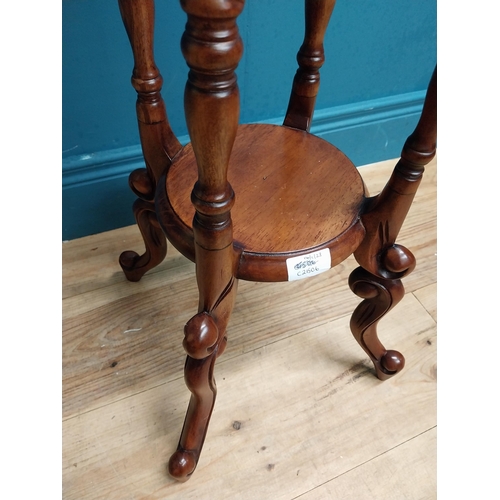 587 - Mahogany jardiniere stand in the Victorian style. {102 cm H x 45 cm Dia.}.