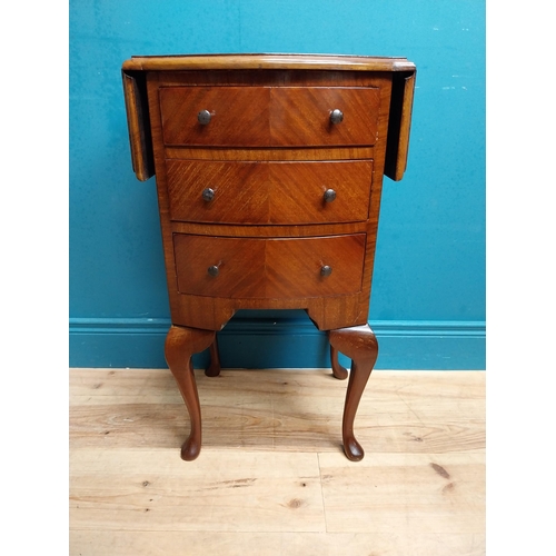 592 - 1950's mahogany drop leaf side table with three drawers. {73 cm H x 42 cm W x 34 cm D}.