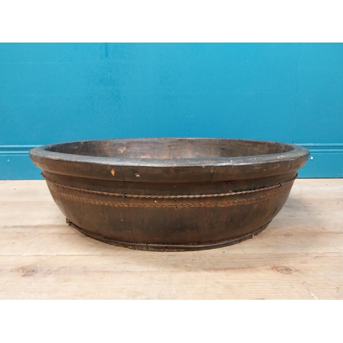 596 - Large early 20th C. wooden bowl with twisted metal banding. {20 cm H x 70 cm Dia.}