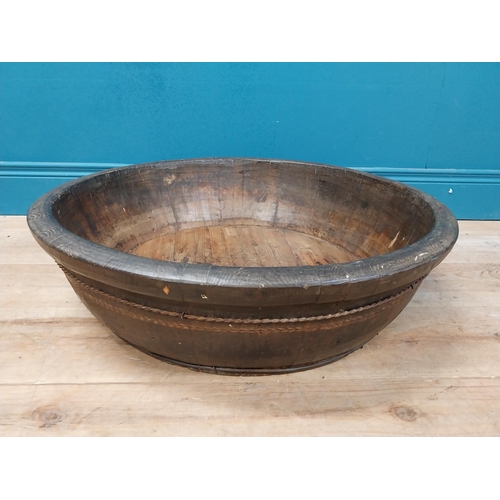 596 - Large early 20th C. wooden bowl with twisted metal banding. {20 cm H x 70 cm Dia.}