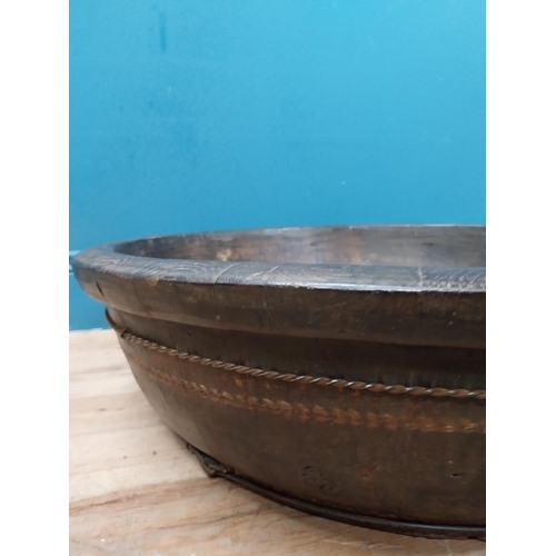 596 - Large early 20th C. wooden bowl with twisted metal banding. {20 cm H x 70 cm Dia.}