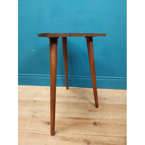 599 - Retro corner table raised on three tapered legs. {61 cm H x 66 cm W x 47 cm D}.